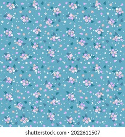 Beautiful floral pattern in small abstract flowers. Small pastel flowers. Pastel Blue background. Ditsy print. Floral seamless background. The elegant the template for fashion prints. Stock pattern.