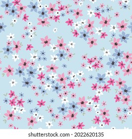 Beautiful floral pattern in small abstract flowers. Small flowers. Pastel Blue background. Ditsy print. Floral seamless background. The elegant the template for fashion prints. Stock pattern.