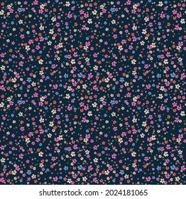 Beautiful floral pattern in small abstract flowers. Small colorful flowers. Dark Blue background. Ditsy print. Floral seamless background. The elegant the template for fashion prints. Stock pattern.