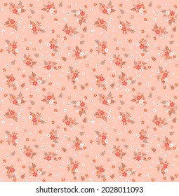 Beautiful floral pattern in small abstract flowers. Small reddish flowers. Pastel coral background. Ditsy print. Floral seamless background. The elegant the template for fashion prints. Stock pattern.