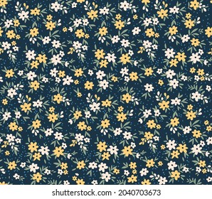 Beautiful floral pattern in small abstract flowers. Small white and yellow flowers. Dark blue background. Ditsy print. Floral seamless background. The elegant the template for fashion prints. Stock. 