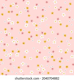 Beautiful floral pattern in small abstract flowers. Small yellow and white flowers. Pink background. Ditsy print. Floral seamless background. The elegant the template for fashion prints. Stock 