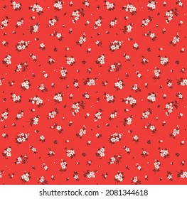 Bel motif floral dans de petites fleurs abstraites. Petites fleurs blanches. Arrière-plan rouge. Impression sale. Arrière-plan floral harmonieux. Le modèle élégant pour les tirages de mode. Motif de stock.
