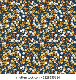 Beautiful floral pattern in small abstract flowers. Small colorful flowers. Blue background. Ditsy print. Floral seamless background. The elegant the template for fashion prints. Stock pattern.