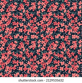 Beautiful floral pattern in small abstract flowers. Small red  flowers. Dark Blue background. Ditsy print. Floral seamless background. The elegant the template for fashion prints. Stock pattern.