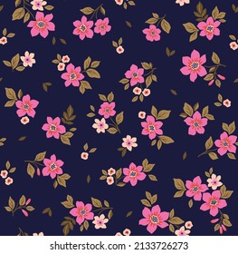 Beautiful floral pattern in small abstract flowers. Small fuchsia flowers. Dark blue background. Ditsy print. Floral seamless background. The elegant the template for fashion prints. Stock pattern.