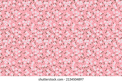 Beautiful floral pattern in small abstract flowers. Small white flowers. Pink background. Ditsy print. Floral seamless background. The elegant the template for fashion prints. Stock pattern.