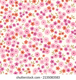 Beautiful floral pattern in small abstract flowers. Small pink and orange flowers. White background. Ditsy print. Floral seamless background. The elegant the template for fashion prints. Stock.