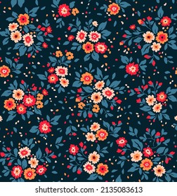 Beautiful floral pattern in small abstract flowers. Small colorful flowers. Dark Blue background. Ditsy print. Floral seamless background. The elegant the template for fashion prints. Stock pattern.