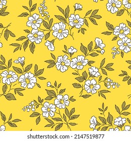 Beautiful floral pattern in small abstract flowers. Small white flowers. Yellow background. Ditsy print. Floral seamless background. The vintage template for fashion prints. Stock pattern.