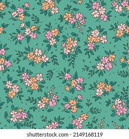 Beautiful floral pattern in small abstract flowers. Small colorful flowers. Blue green background. Ditsy print. Floral seamless background. The elegant the template for fashion prints. Stock pattern.