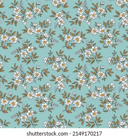 Beautiful floral pattern in small abstract flowers. Small white flowers. Blue background. Ditsy print. Floral seamless background. The elegant the template for fashion prints. Stock pattern.