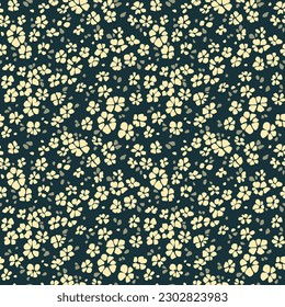 Beautiful floral pattern in small abstract flowers. Small white flowers. Dark blue background. Ditsy print. Floral seamless background.  Cute pattern for design and fashion prints. Stock pattern.
