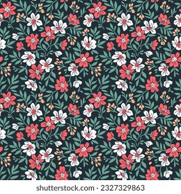 Beautiful floral pattern in small abstract flowers. Small red and white flowers. Dark blue background. Ditsy print. Floral seamless background. Liberty template for fashion prints. Stock pattern.