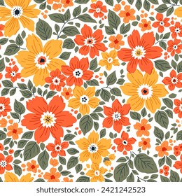 Beautiful floral pattern in small abstract flowers. Small yellow and orange flowers. White background. Ditsy print. Floral seamless background. Liberty template for fashion prints. Stock pattern.