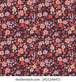 Beautiful floral pattern in small abstract flowers. Small pink, red and coral flowers. Dark background. Ditsy print. Floral seamless background. Liberty template for fashion prints. Stock pattern.