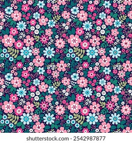 Beautiful floral pattern in small  abstract flowers. Small bright color flowers. Dark blue background. Ditsy print. Floral seamless background. Elegant template for fashion prints. Stock print.