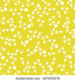 Beautiful floral pattern of small flowers . Small white flowers . Bright yellow background. Print a color in a flower. Floral seamless background. Elegant template for fashionable prints.