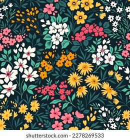 Beautiful floral pattern in small flowers. Small colorful flowers. Black background. Ditsy print. Floral seamless background. Elegant template for fashion prints. Stock pattern.