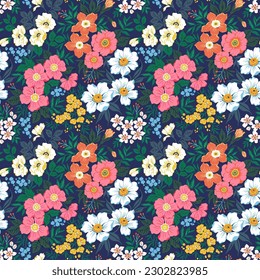 Beautiful floral pattern in small flowers. Small colorful flowers. Dark blue background. Liberty print. Floral seamless background. Trendy template for fashion prints. Stock pattern.