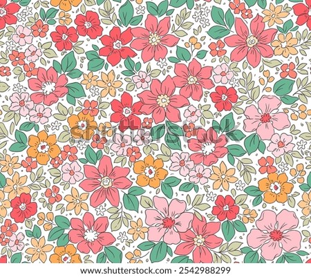Beautiful floral pattern in small flowers. Small red, orange and pink flowers. White background. Liberty print. Floral seamless background. Elegant template for fashion prints. Stock pattern.