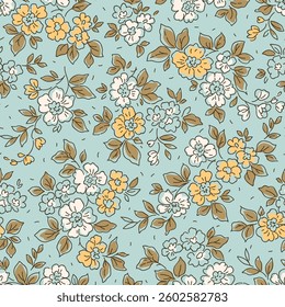 Beautiful floral pattern in small vintage flowers. Small white and yellow flowers. Light blue background. Ditsy print. Floral seamless background. Gentle template for fashion prints. Stock pattern.