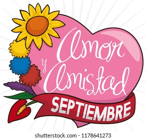 Beautiful flower set with  the colors of the Colombian flag in the pompoms, pink heart and ribbon to celebrate Love and Friendship Day (written in Spanish) in September.
