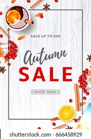 Beautiful flyer for autumn sale. Top view on composition with cup of mulled wine, rowan, cinnamon sticks on wooden texture. Vector illustration.