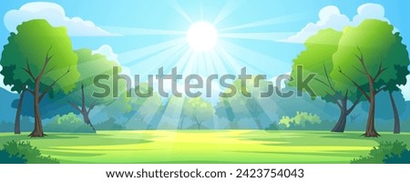 Beautiful forest clearing in the rays of the summer sun. Landscape of green grass in a glade with trees on the sides and dense forest, warm rays of the sun, bare sky, and clouds.