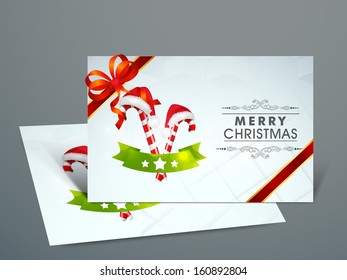 Beautiful Gift Cards for Happy New Year and Merry Christmas celebrations with red ribbon  and Santa Claus cane and cap and space for your wishes. 