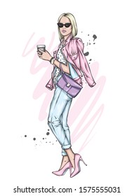 Beautiful girl with a bob hairstyle in a stylish jacket, jeans and high-heeled shoes. Woman with a glass of coffee. Fashion and style, clothes and accessories. Vector illustration for a card or poster