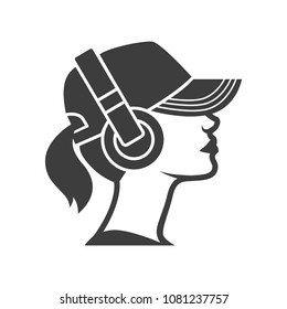 Beautiful girl in cap and headphones. DJ woman