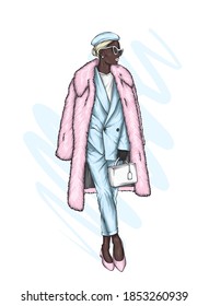 A beautiful girl in a coat and beret. Fashion and style, clothing and accessories.