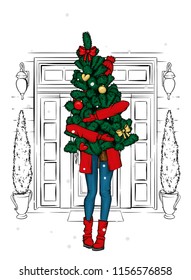 A Beautiful Girl In A Coat And Boots Is Holding A Christmas Tree. New Year's And Christmas. Winter And Holidays. Vector Illustration For A Postcard Or A Poster. Fashion Illustration.