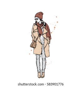 Beautiful girl in a coat with a cap and a scarf. Stylishly dressed woman. Vector fashion illustration.
