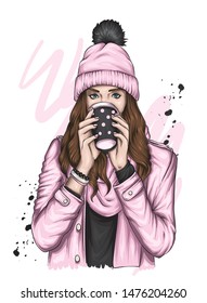 Beautiful girl in a hat with a bubo and with a glass of coffee or tea. Woman with long hair in stylish clothes. Fashion and style, accessories. Autumn, winter, warm drink. Hipster.