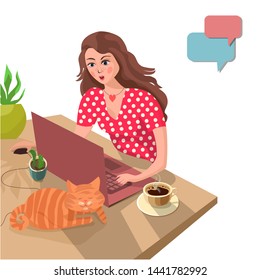Beautiful girl at the home table communicates with her boyfriend online. Home comfort, coffee and cat. The concept of online dating.