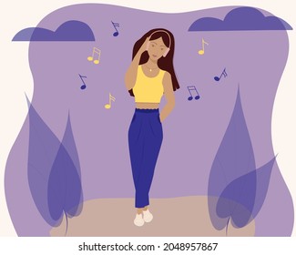 A beautiful girl listens to music.