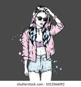 A beautiful girl with long hair in a leather jacket with thorns and in shorts. Vector illustration for a postcard or a poster, print for clothes. Fashion and style, clothing and accessories.