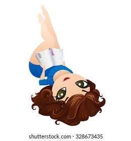 Beautiful girl lying down and reading a book