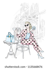 A beautiful girl in pants and a jacket is sitting in a cafe. Vector illustration. Clothing and accessories, vintage and retro.
