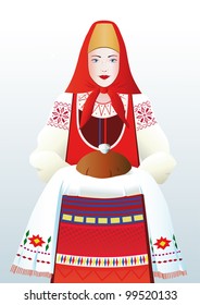 Beautiful girl in a Russian national costume greets guests with bread and salt.