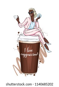 Beautiful girl is sitting on a glass of coffee. Vector illustration for a postcard or a poster. Hand drawing. Coffee to go. Fashion & Style.