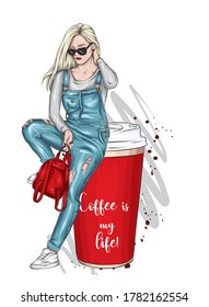 Beautiful girl is sitting on a glass of coffee. Vector illustration for a postcard or a poster. Hand drawing. Coffee to go. Fashion & Style.