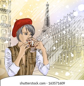 Beautiful girl in the street cafe in Paris drinking coffee 