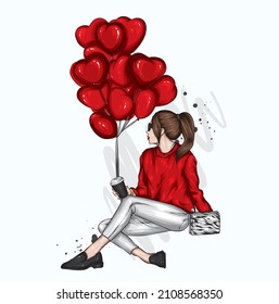 Beautiful girl in stylish clothes and balloons in the form of hearts. Valentine's Day and Love.