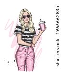 Beautiful girl in stylish clothes and a cocktail. Fashion and Style.