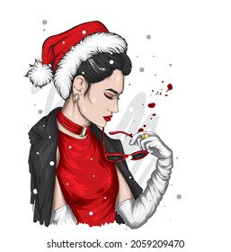 A beautiful girl in stylish clothes and a New Year's hat. New Year and Christmas, Santa Claus. Fashion  Style. 
