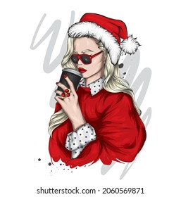 A beautiful girl in stylish clothes and a New Year's hat. New Year and Christmas, Santa Claus. Fashion  Style. 