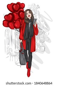 Una mujer hermosa con un abrigo elegante, bufanda, jeans y botas. Ropa y accesorios de moda, moda y estilo. Globos con forma de corazón. Día de San Valentín.